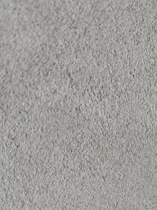 A coarse sand-grain plaster finish